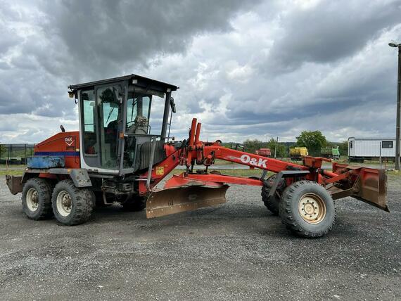 GREJDR O&K F 106.5 A 6x6+NIVELACE TOPCON