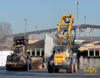 Liebherr L 580 2plus2 LogHandler, vlevo Volvo L180E High-Lift