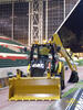 Caterpillar 428E na stadionu ragbyového klubu Leicester Tigers