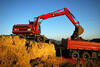 Caterpillar M315 v netradiční červené