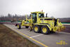 Grejdr Caterpillar 12H firmy F.Kirchhoff s přední radlicí Stabau a nivelací Trimble