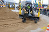 Pásový smykem řízený nakladač Caterpillar 299C high Flow XPS Two Speed s grejdrem GF Gordini LG 250 P a nivelací Trimble Spectra Precision