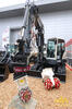 Pásové rypadlo Terex TC125 s rotátorem Holp Rototop RT 121 a skalní frézou Terex
