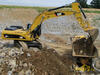 Nakládání kloubového dempru Volvo A30D pásovým rypadlem Caterpillar 330D LN