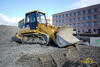 Pásový nakladač Caterpillar 953C firmy Skanska DS