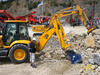 Rypadlonakladač JCB 4CX Sitemaster se lžící Picbucket s úderným rozrušováním