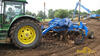 Kolový traktor John Deere 7920 s přípojným grejdrem a laserovou nivelací