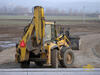 Rypadlonakladač Komatsu WB97S firmy Skanska BS