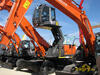 Kolové rypadlo Hitachi Zaxis 250 W v provedení pro překládku materálu
