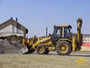 Rypadlo-nakladač Caterpillar 438B firmy OHL ŽS