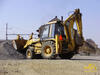 Rypadlo-nakladač Caterpillar 438B firmy OHL ŽS