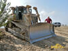 Pásový dozer Caterpillar D6R pracující pro Vodohospodářské stavby