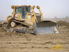 Pásový dozer Caterpillar D6R XW pracující pro Vodohospodářské stavby