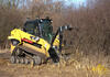 Pásový smykem řízený Caterpillar 277C High Flow XPS s mulčovací frézou Caterpillar HM312