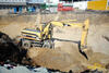 Kolové rypadlo Caterpillar M 318 firmy Skanska DS