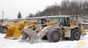 Dvě generace nakladačů Caterpillar, v popředí starší 988G, za ním nový 988H