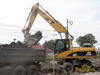 Kolové rypadlo Caterpillar M 318C firmy Szarzec