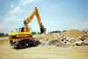 JCB JS175W firmy KAPOUN s.r.o. odklízí radlicí suť