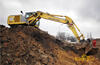 Kolové rypadlo New Holland MH City firmy ZV Servis Praha