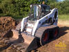 Bobcat S300 s pásy Solideal OTT