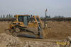 Dozer Caterpillar D6R XL firmy Trymet hrne materiál