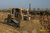Dozer Caterpillar D6R XL firmy Trymet srovnává prostor pro budoucí komunikace