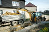 Rypadlonakladač Caterpillar 424D firmy Myfa Olomouc nakládá Tatru T 815