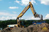 Kolové rypadlo Caterpillar M318 firmy D.I.S.