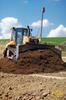 Pásový dozer Caterpillar D6N XL firmy PB SCOM s laserovou nivelací