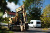 Kolové rypadlo Caterpillar M313C na ulici Michálkovická
