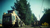 Smykem řízený nakladač Caterpillar 226 na ulici K Pískovně