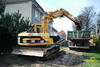 Pásové rypadlo Caterpillar 312 firmy Insta s ofsetovým výložníkem