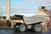 Pevný dempr Caterpillar 775D s trakčními řetězy Pewag Compact Cross 14