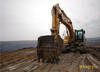 Pásové rypadlo Caterpillar 325D s lopatou na zakázku