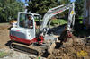 Pásové rypadlo Takeuchi TB 235 a využití powertiltu