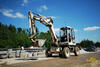 Kolové midirypadlo Komatsu PW 95 jede se štěrkem