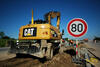 Kolové rypadlo Caterpillar M313D s nivelací Trimble firmy Petr Prudký