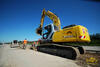 Pásové rypadlo New Holland Kobelco E215B firmy Alpine