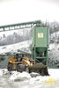 Kolový nakladač Caterpillar 988H s ochrannými řetězy Pewag Square Granit 18