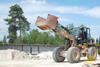 Kolový nakladač Caterpillar 930G s prázdnou bednou