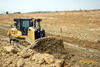 Pásový dozer Caterpillar D7E na zemním tělese dálnice z Přerova do Lipníku nad Bečvou