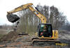 Levý bok pásového rypadla Caterpillar 311F LRR