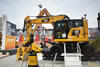 Dvoucestné rypadlo Caterpillar M323F s podbíječkou Kinshofer DT 03