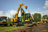 Kolové rypadlo Hydrema MX16 s pásovým minirypadlem Yanmar ViO50