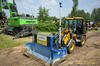 Kolový nakladač JCB 406 s automatickou grejdrovací radlicí AP Machinebouw Leveller LEV2200 3D řízený totální stanicí