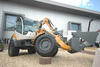 Kolový nakladač Liebherr L506 Compact s kombinovanou lopatou