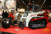 Pásový smykem řízený nakladač Takeuchi TL 240 s frézou na pařezy Bradco SG30