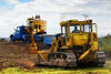 21. Dozer DZ 170 nahrnuje pod bagr D-030