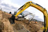Pásové minirypadlo Wacker Neuson 28Z3, v pozadí Bobcat E35