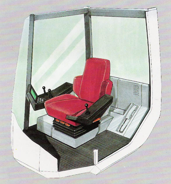 Kabina - všimněte si sluchátka za sedadlem